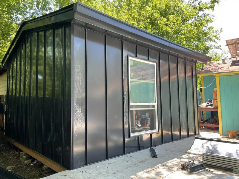 Black standing seam metal wall panels for Roof Inspection in Warrensburg