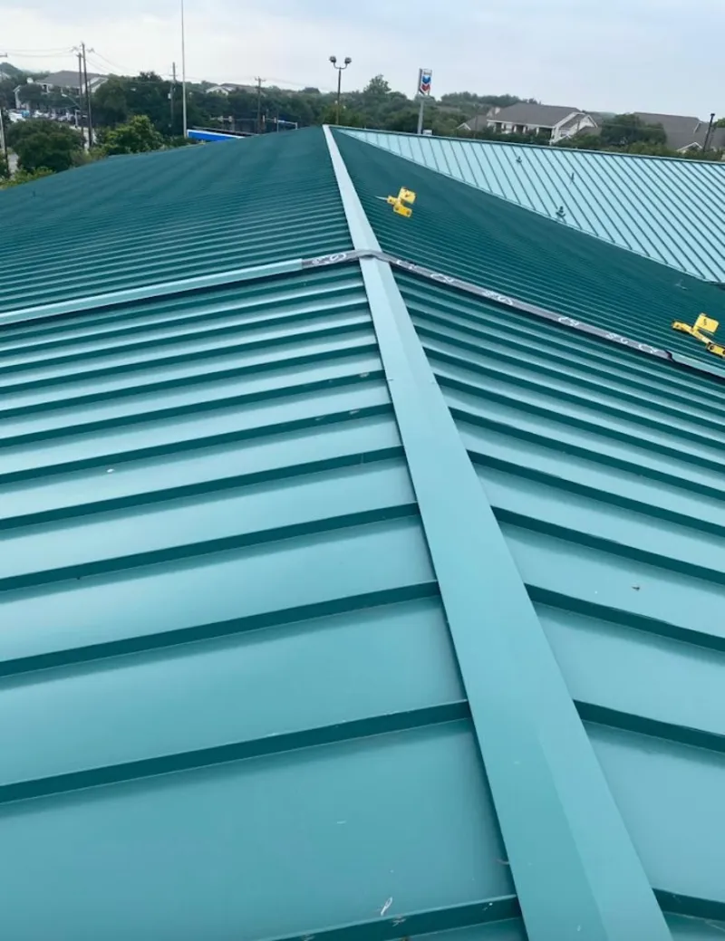 Green commercial metal roof ridge and valley for Metal Roof Repair in Warrensburg